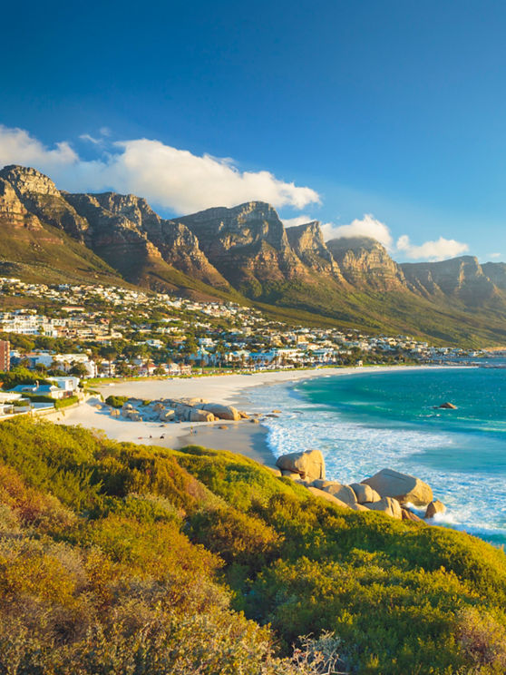 Beach and Twelve Apostles mountain in Camps Bay near Cape Town in South Africa.